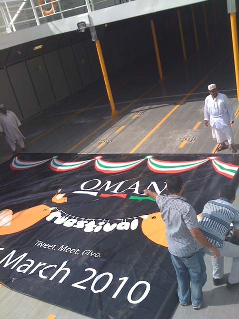 Record size #OmanTwestival banner 6men carried it on2 Hormuz deck - venue of Oman's 1st Twestival via @SangitaSri